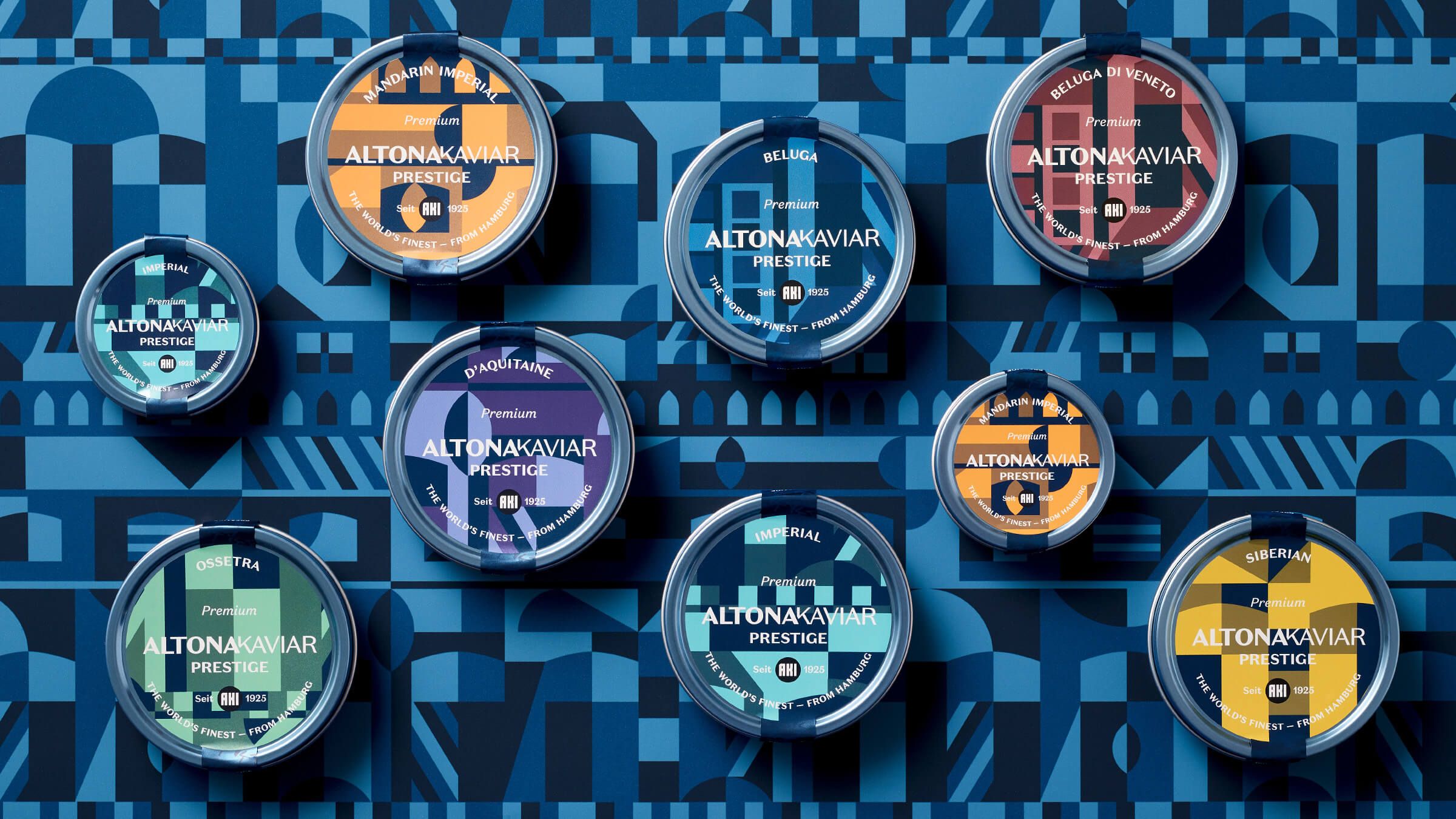 Auf einem blauen Muster liegen neun Dosen der Linie PRESTIGE. Alle haben eine ander Farbe.
