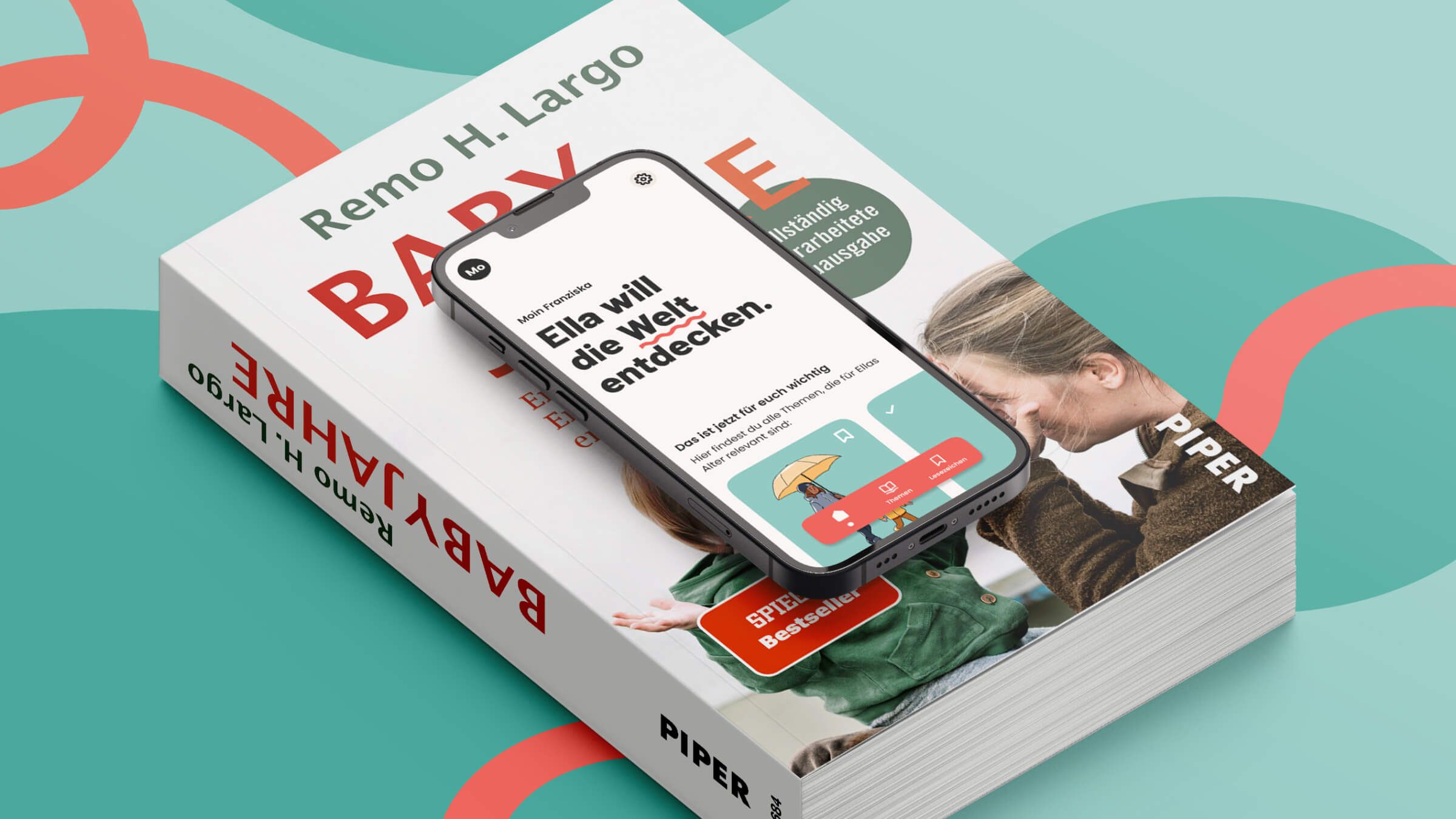 Die geöffnete Babyjahre App ist auf einem Smartphone zu sehen und liegt auf dem Buch Babyjahre